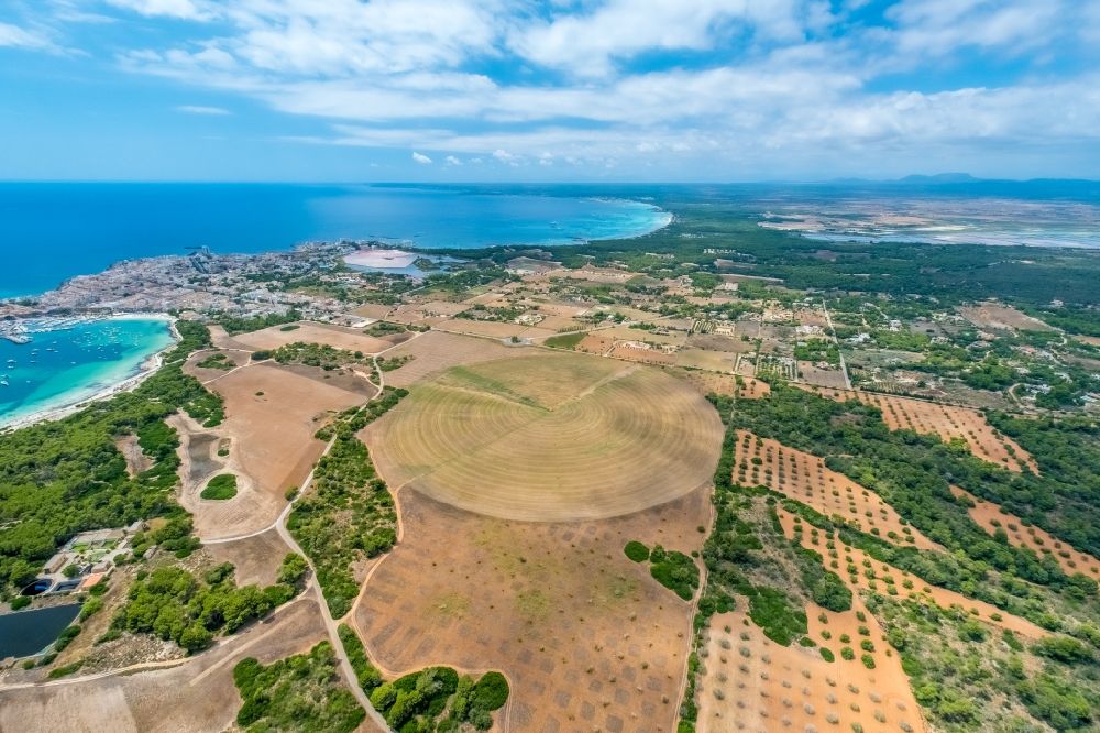Ses Salines from above - Circular round arch of a pivot irrigation system on agricultural fields in Ses Salines in Balearische Insel Mallorca, Spain