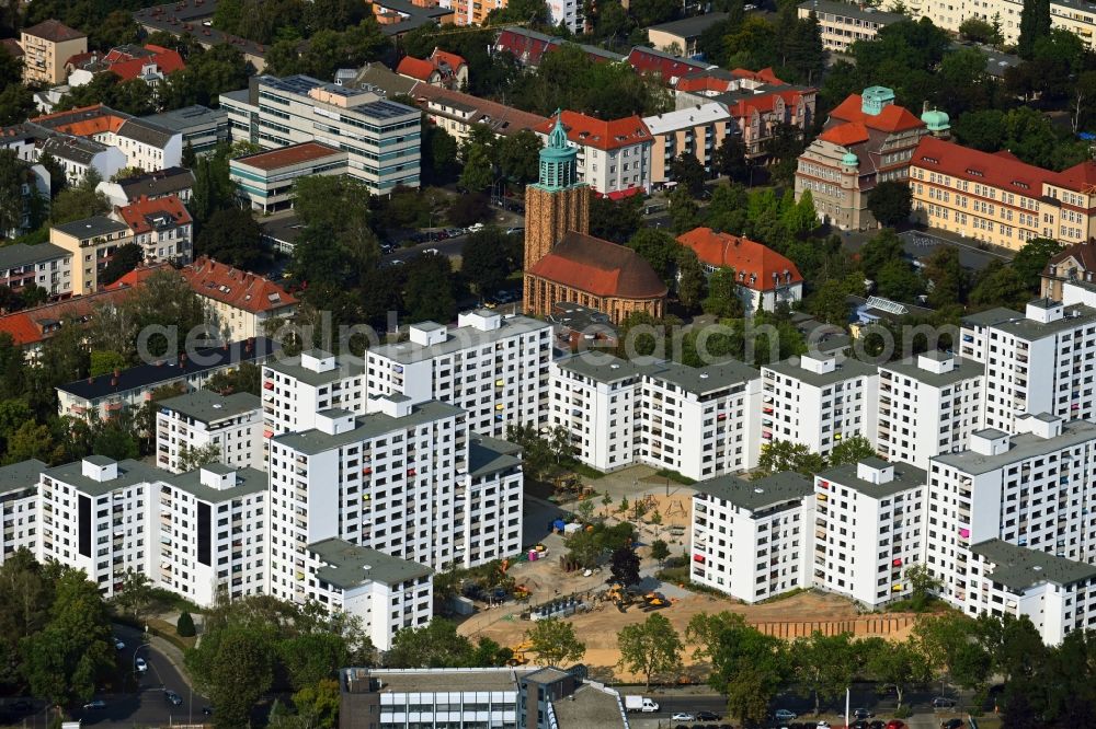 Berlin from above - Skyscrapers in the residential area of industrially manufactured settlement on Rathausstrasse overlooking the church building of the Martin-Luther-Gedaechtniskirche in the district Mariendorf in Berlin, Germany