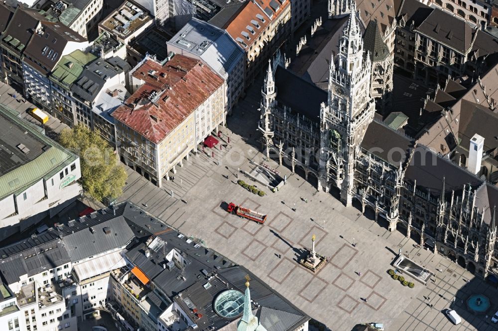Aerial image München - Ensemble space Marienplatz on Town Hall during the Corona Lockdown in the inner city center in Munich in the state Bavaria, Germany