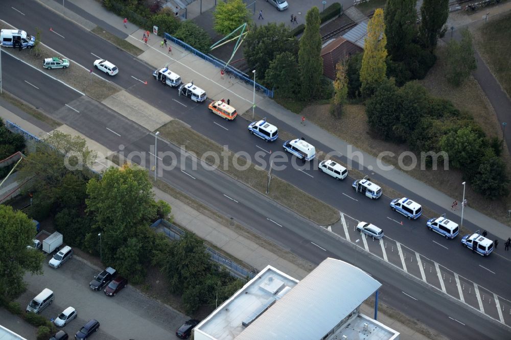 Cottbus from above - Police and ambulance cars and vehicles in front of the Messe exhibition centre on Stadtring road in Cottbus in the state of Brandenburg. Several police cars and ambulance are lined up in a row on the multi-lane road