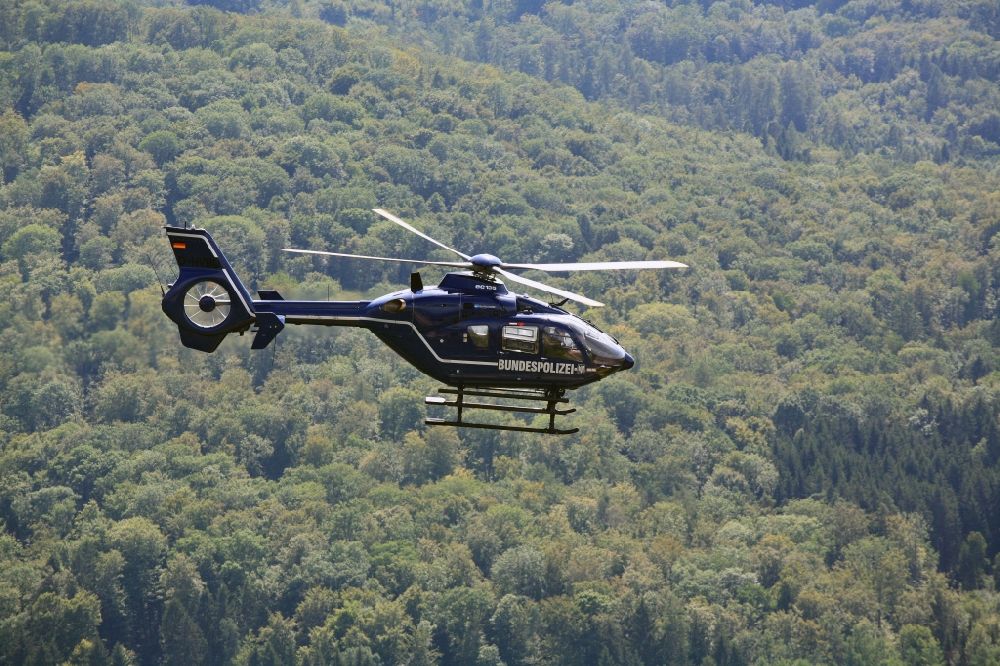 Aerial image Rheinfelden (Baden) - Helicopter in flight EC 135 of federal police mission D-HVBD over the air space in Rheinfelden (Baden) in the state Baden-Wuerttemberg
