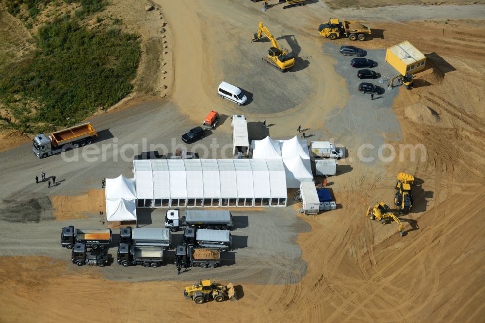 Wedemark from the bird's eye view: Promotion and advertising event for Mercedes-Benz commercial vehicles on white tent camp on the gravel pit in Wedemark in the state Lower Saxony