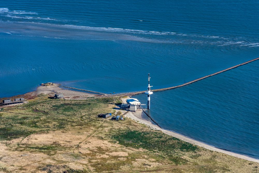 Wangerooge from the bird's eye view: Coastal landscape on the sandy beach of the Minsener oog radar tower there is a larger crew area in the form of stilt houses for the WSA employees in the North Sea in the state Lower Saxony, Germany