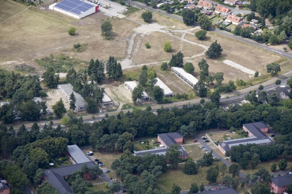 Wustermark OT Elstal from above - The peripheral development of the former Olympic Village in Elstal in Brandenburg. The original edge development is largely destroyed. Former garage areas are designed as exclusive residences