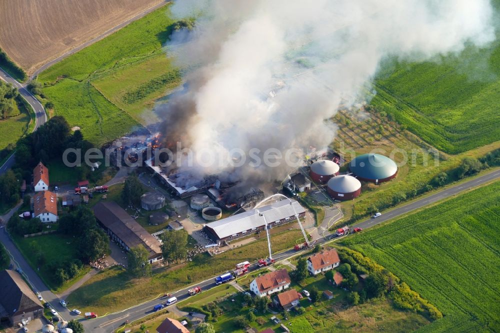 Aerial photograph Dassel - Smoke and flames during the fire fighting to fire on Experimental property of the University of Goettingen in the district Relliehausen in Dassel in the state Lower Saxony, Germany