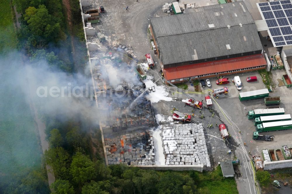 Aerial image Witzenhausen - Smoke and flames during the fire fighting to fire of company Heil Recycling in Witzenhausen in the state Hesse, Germany