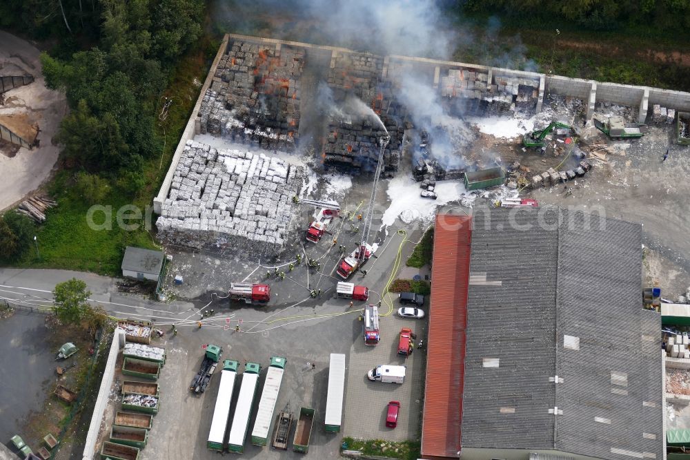 Aerial photograph Witzenhausen - Smoke and flames during the fire fighting to fire of company Heil Recycling in Witzenhausen in the state Hesse, Germany