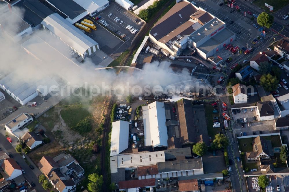 Aerial photograph Speyer - Smoke and flames during the fire fighting to fire of a storage all for antiqities in the Werkstrasse in Speyer in the state Rhineland-Palatinate, Germany