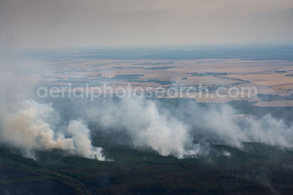 Aerial image Bardenitz - Smoke clouds by the Great Fire - destroyed forest fire tree population in a wooded area - forest terrain in Bardenitz in Treuenbrietzen in the state Brandenburg, Germany