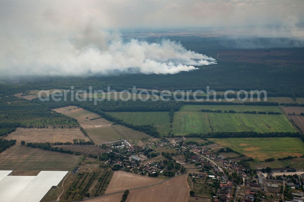 Aerial photograph Kemnitz - Smoke clouds by the Great Fire - destroyed forest fire tree population in a wooded area - forest terrain in Kemnitz near Treuenbrietzen in the state Brandenburg, Germany