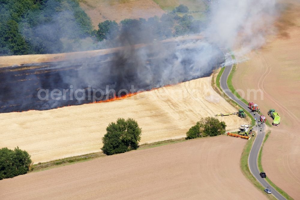 Dieterode from above - Smoke clouds of a fire in a cornfield in Dieterode in the state Thuringia, Germany