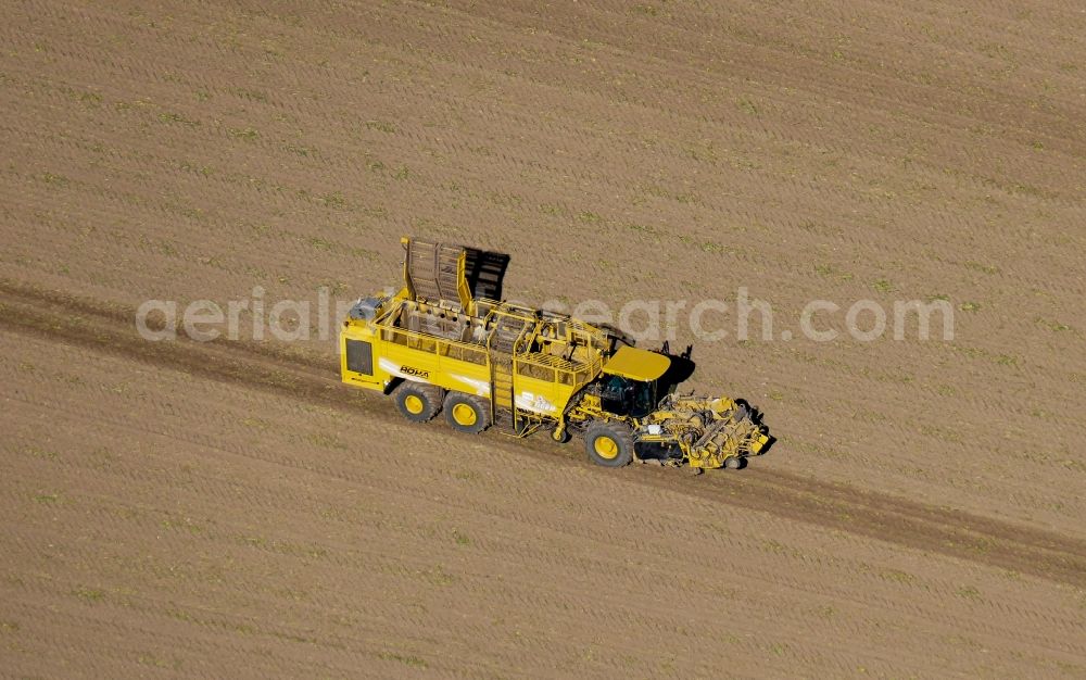 Aerial photograph Gleichen - Harvest use of heavy agricultural machinery - beet harvest in Gleichen in the state Lower Saxony, Germany
