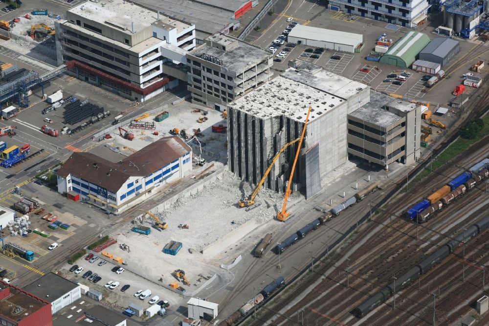 Muttenz from above - Dismantling of a high-bay warehouse complex and logistics center on the site of Novartis Pharma Schweizerhalle in Muttenz in the canton Basel-Landschaft, Switzerland