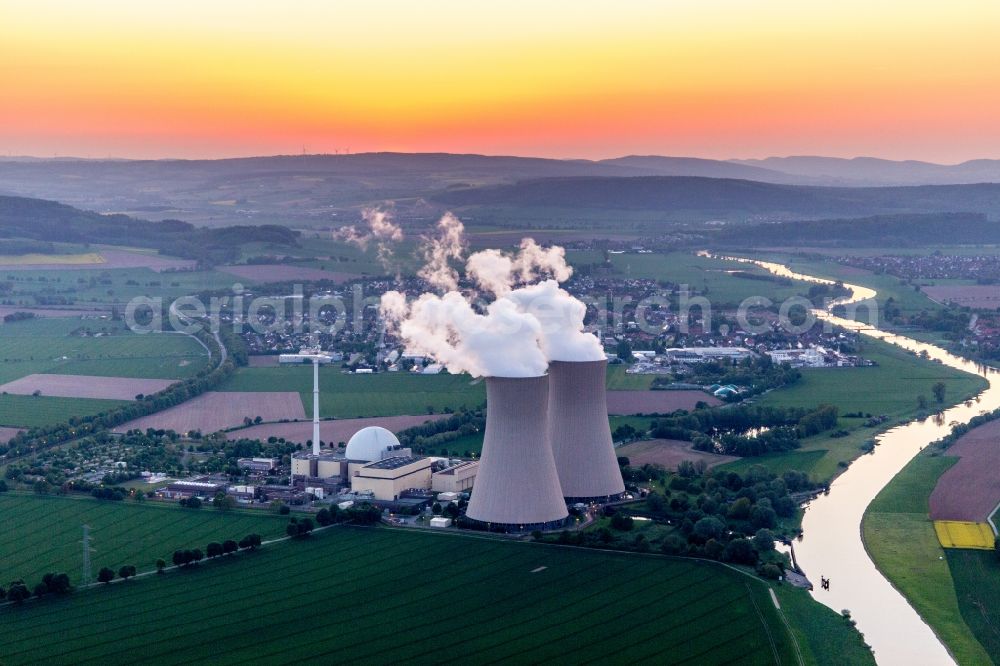 Aerial photograph Grohnde - Building remains of the reactor units and facilities of the NPP nuclear power plant Grohnde on the river Weser during sunset in Grohnde in the state Lower Saxony, Germany