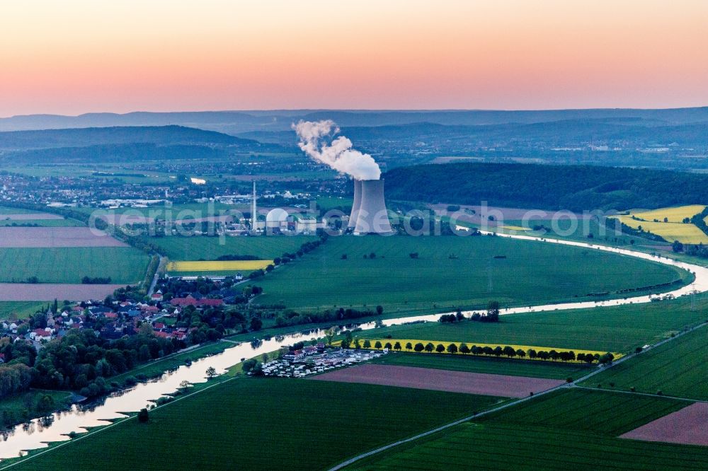 Emmerthal from above - Building remains of the reactor units and facilities of the NPP nuclear power plant Grohnde on the river Weser during sunset in Grohnde in the state Lower Saxony, Germany