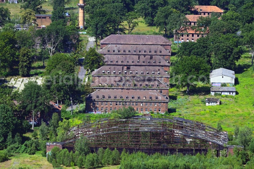 Oberkrämer from the bird's eye view: Remains of hangar aircraft hangars at the former Schoenwalde airfield in the district of Boetzow in Oberkraemer in the state of Brandenburg, Germany