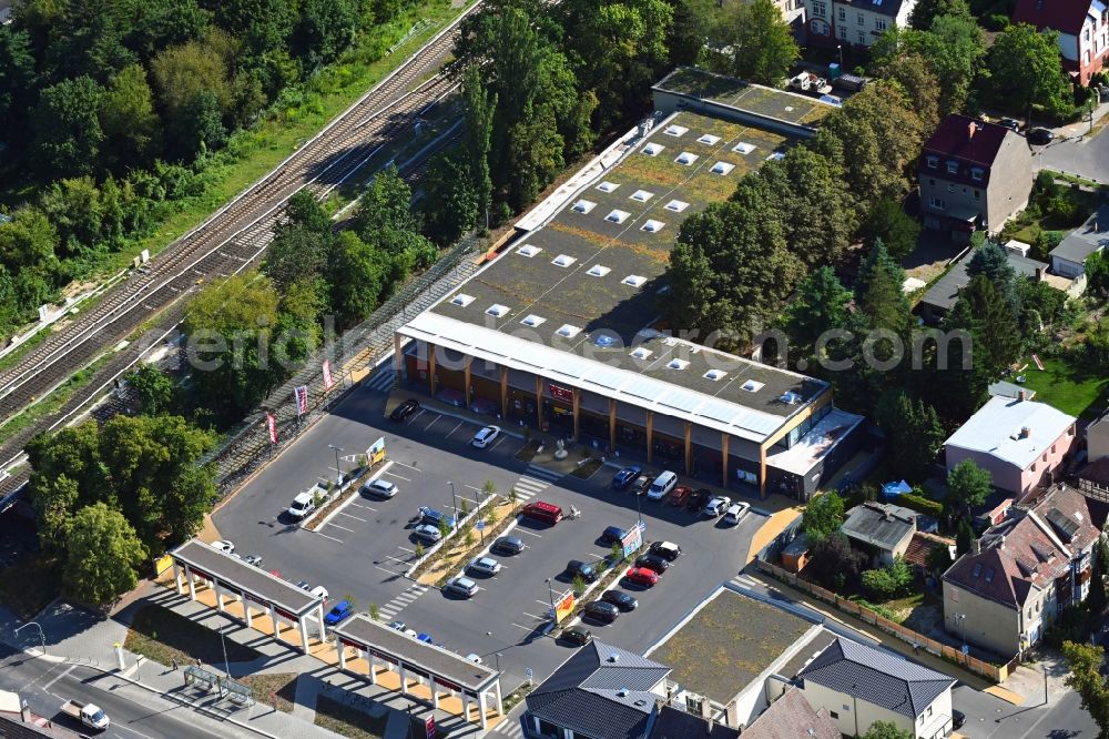Aerial image Berlin - Building complex of the REWE shopping center on Hoenower Strasse in the district Mahlsdorf in Berlin, Germany