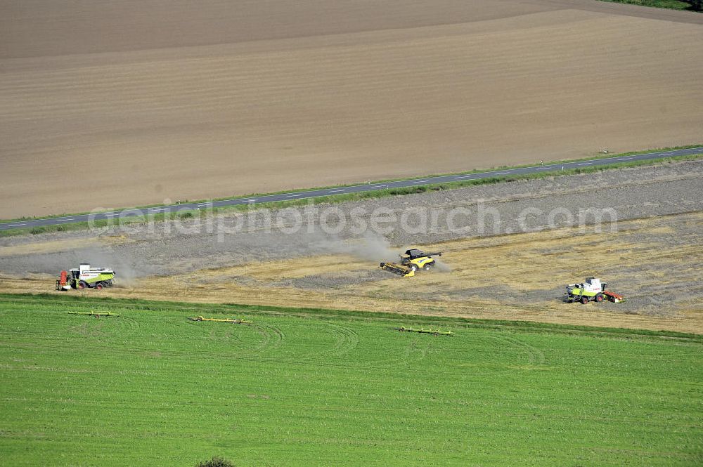 Aerial photograph Beesenstedt - Mähdrescher- Einsatz zur hebstlichen Roggenernte auf einem Feld in der Nähe von Beesenstedt. Harvest of rye near Beesenstedt.