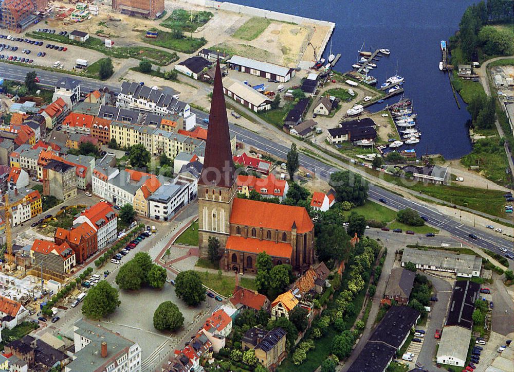 Aerial photograph Rostock - View of the city center of Rostock. Was on a 14-meter high plateau in the 14th Century built St. Peter's Church. The mighty west tower, with 117 m height, the tallest building in the city. Right above the eastern harbor
