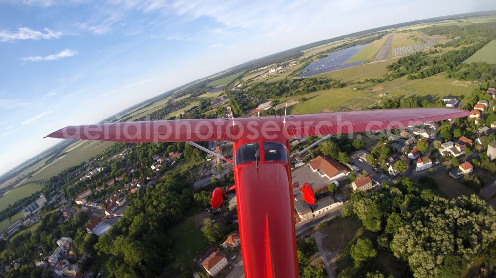 Aerial image Werneuchen - Read colored Light aircraft Cessna 172 D-EGYC Agency euroluftbild.de on runway 08 of airfield in Werneuchen in the state Brandenburg