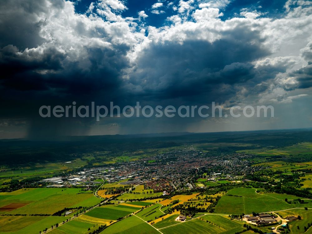 Rottenburg from the bird's eye view: The city of Rottenburg am Neckar in the state of Baden-Württemberg. The city is located in the county of Tübingen. The overview shows the surrounding area of the city and stormy weather