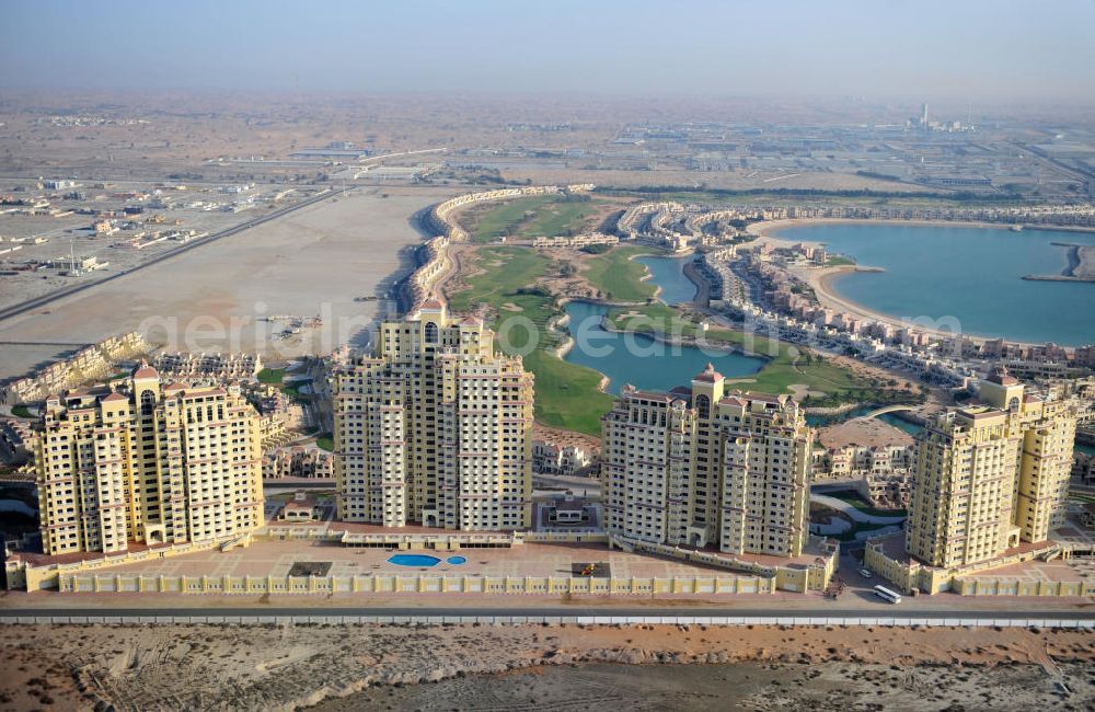 Ras Al Khaimah from above - Complex of Royal Breeze Residence in the arab emirate Ras Al Khaimah. The complex is part of the Al Hamra Village Project, the second largest construction project of Ras Al Khaimah and consists of apartments, penthouses, swimming pools and gardens. The project is realized by the state-owned company Al Hamra Real Estate
