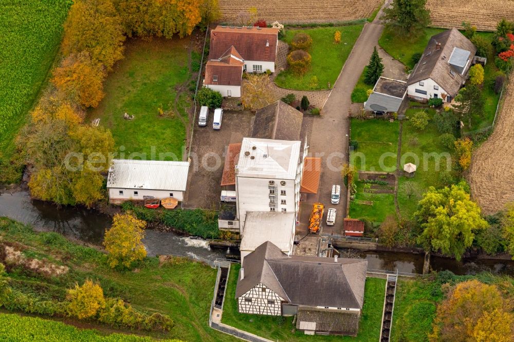 Schwanau from above - Historic mill on a farm homestead on the edge of cultivated fields in Schwanau in the state Baden-Wurttemberg, Germany