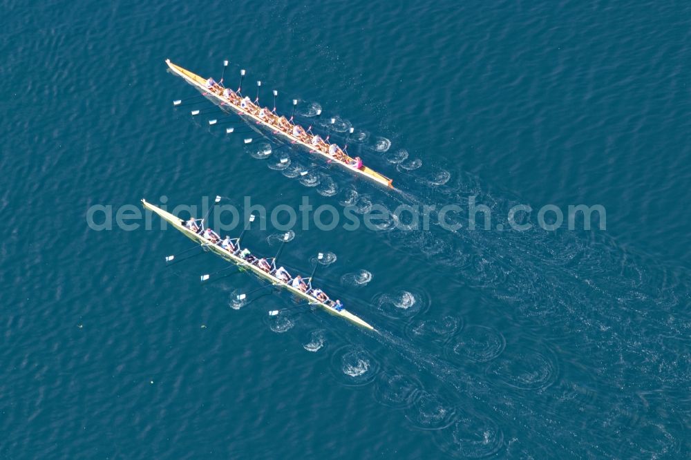 Pöcking from the bird's eye view: Rowing boats at the rowing regatta Roseninsel-8er on the Starnberger See in front of Possenhofen in the state of Bavaria. The event is annually organized by the Munich Rowing and Sailing Association