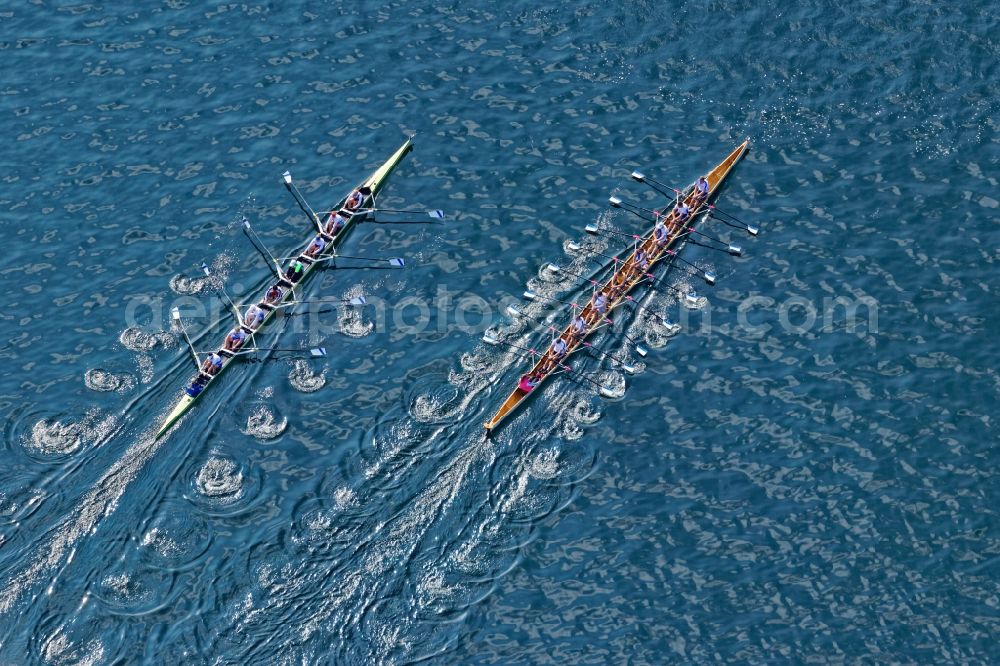 Aerial photograph Pöcking - Rowing boats at the rowing regatta Roseninsel-8er on the Starnberger See in front of Possenhofen in the state of Bavaria. The event is annually organized by the Munich Rowing and Sailing Association
