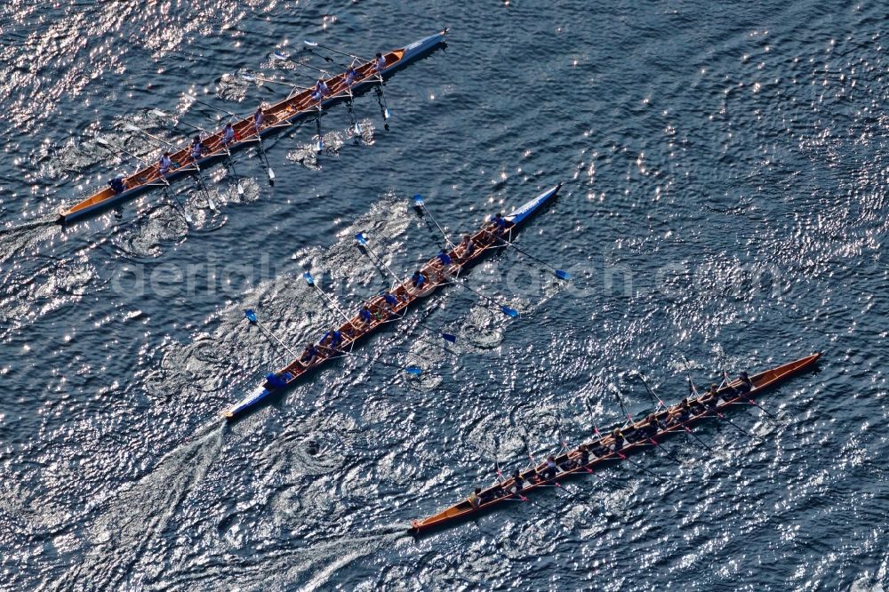 Aerial photograph Starnberg - Rowing boats at the rowing regatta Roseninsel-8er on the Starnberger See in front of Starnberg in the state of Bavaria. The event is annually organized by the Munich Rowing and Sailing Association
