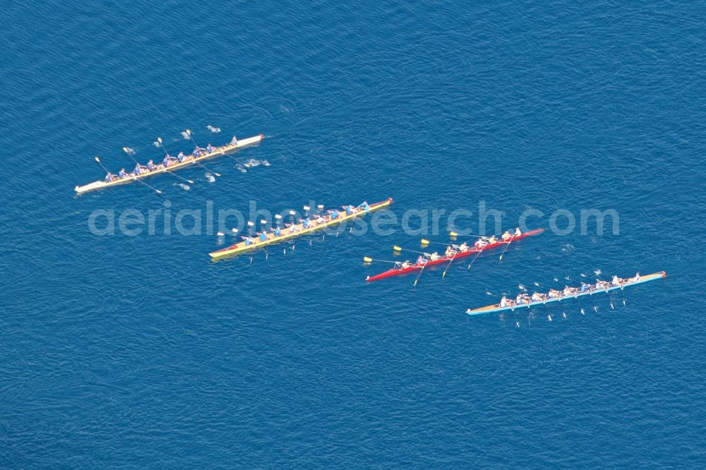 Starnberg from the bird's eye view: Rowing boats at the rowing regatta Roseninsel-8er on the Starnberger See in front of Starnberg in the state of Bavaria. The event is annually organized by the Munich Rowing and Sailing Association