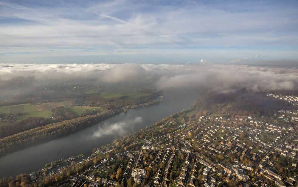 Aerial image Essen - Overlooking the Ruhr peninsular Heisingen with a view of the lake Baldeneysee and the Essen district Fischlaken covered with a thick layer of autumn weather fog and clouds in the state North Rhine-Westphalia