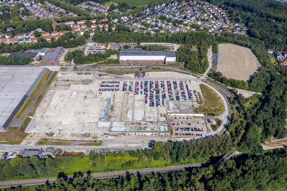 Aerial image Bochum - Ruin the buildings and halls at the building complex and premises of the logistic center of Opel Group Warehousing GmbH with parking space for cars in the district Langendreer in Bochum in the state North Rhine-Westphalia, Germany