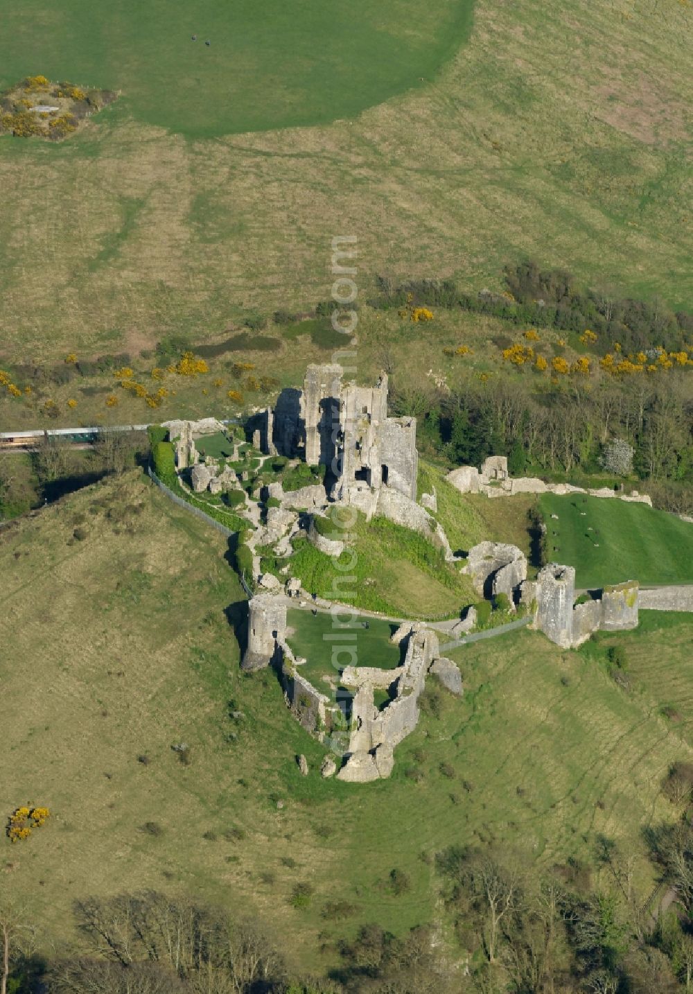 Corfe Castle from the bird's eye view: Ruins and vestiges of the former castle and fortress Corfe Castle on The Square in Corfe Castle in England, United Kingdom