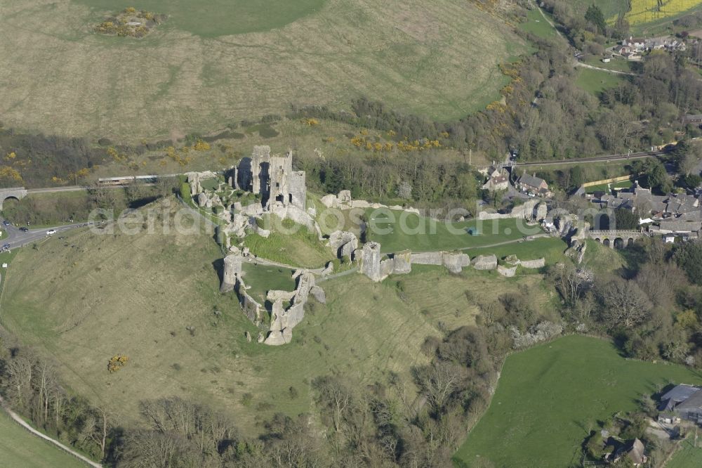 Aerial image Corfe Castle - Ruins and vestiges of the former castle and fortress Corfe Castle on The Square in Corfe Castle in England, United Kingdom
