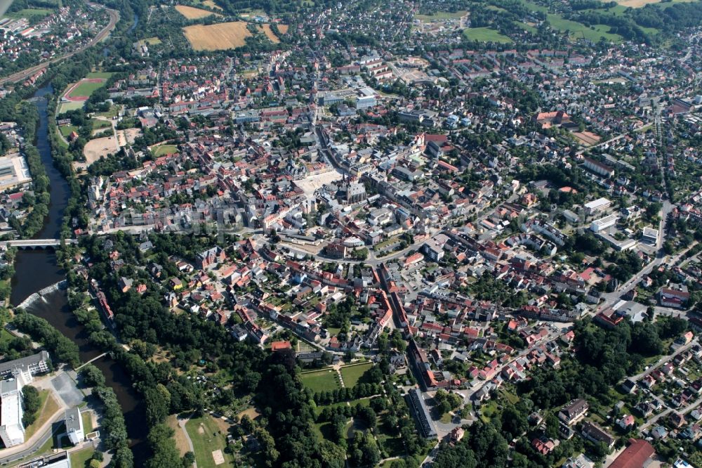 Aerial photograph Saalfeld/Saale - Saalfeld is a town in the southeast of the state of Thuringia. In the historic city on the banks of the river Saale are many places of interest. Outstanding are the Renaissance town hall on the market, the Gothic Church of St. John, the former Franciscan monastery, now serves as the municipal museum, the Blankenburger Gate and the Saaltor Gate, two former parts of the city walls and the ruins of High swarm . In addition to the urban development with multi-family houses there on the edge of downtown commercial establishments. The medical technology company Trumpf GmbH on the banks of the Saale their establishment