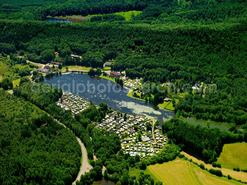 Aerial image Ludwigswinkel - Saarbach creek and Saarbacherhammer camping facilities in Ludwigswinkel in the state of Rhineland-Palatinate. The compound around the swimming lake Muehlweiler includes caravan campsites, tent sites and the restaurant Die Zwickmuehle. The area is located in the biosphere reserve Palatinate Forest - North Vosges in a forest