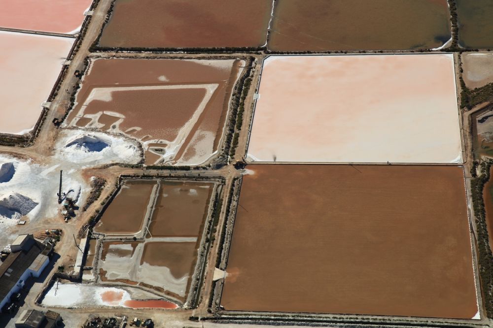 Colonia de Sant Jordi from the bird's eye view: Brown - white pink salt pans for salt extraction Ses salines d'es trenc in Mallorca in Balearic Islands, Spain