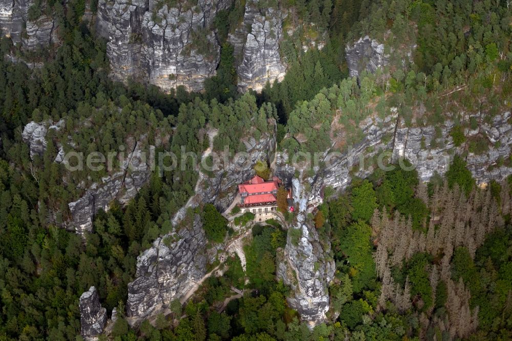 Aerial image Hrensko - Rock massif and rock formation Prebischtor (Pravcicka brana) in Hrensko in Ustecky kraj - Aussiger Region, Czech Republic