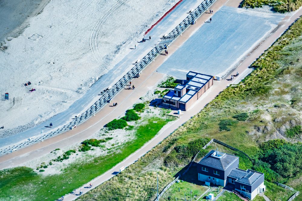 Norderney from above - Sandy beach and dune landscape on the northern edge with beach baskets on the island of Norderney in the state of Lower Saxony, Germany