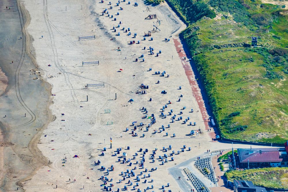 Norderney from the bird's eye view: Sandy beach and dune landscape on the northern edge with beach baskets on the island of Norderney in the state of Lower Saxony, Germany