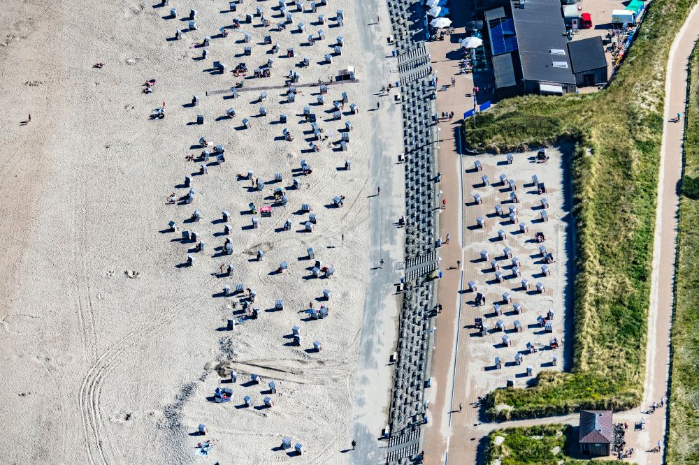 Aerial image Norderney - Sandy beach and dune landscape on the northern edge with beach baskets on the island of Norderney in the state of Lower Saxony, Germany