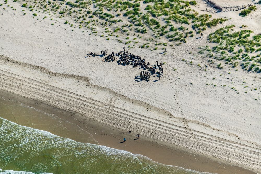 Norderney from above - Sandy beach landscape Bundeswehr soldiers on the beach of Norderney in the state Lower Saxony, Germany