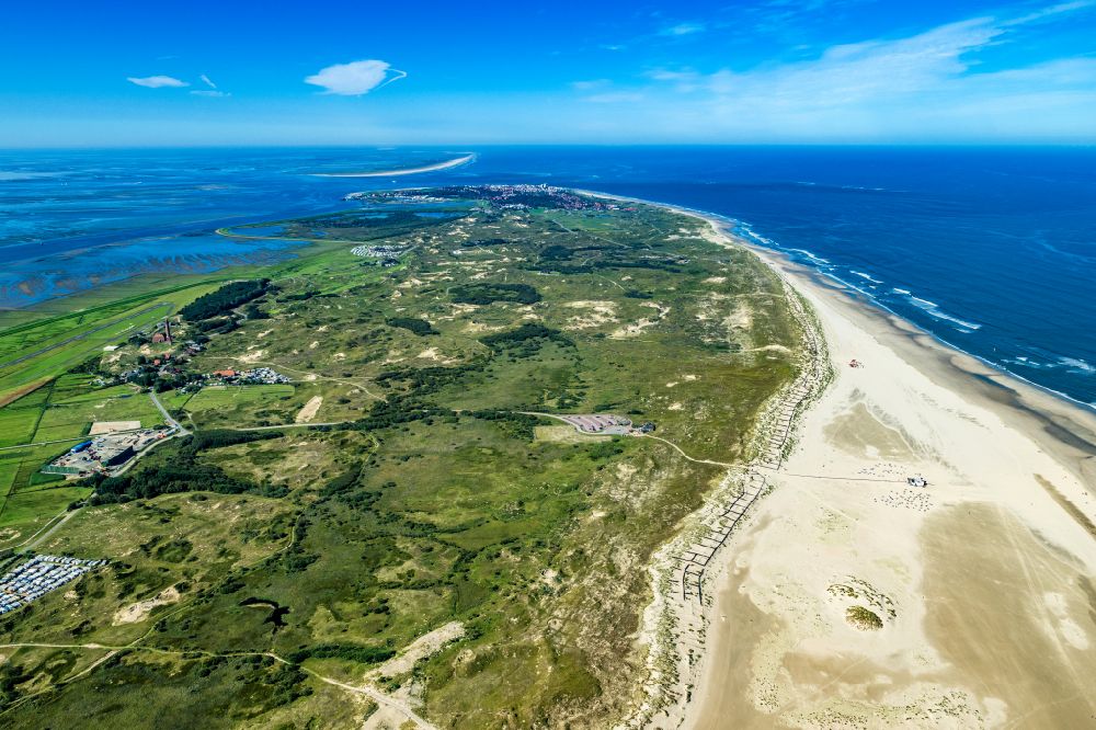 Norderney from above - Sandy beach landscape and dune protection wall along the coast on the island of Norderney in the state of Lower Saxony, Germany