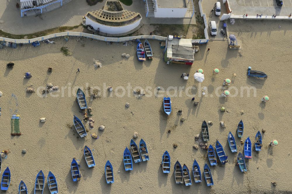 Martil from the bird's eye view: Beach landscape along the with fishing boats in Martil in Tanger-Tetouan-Al Hoceima, Morocco