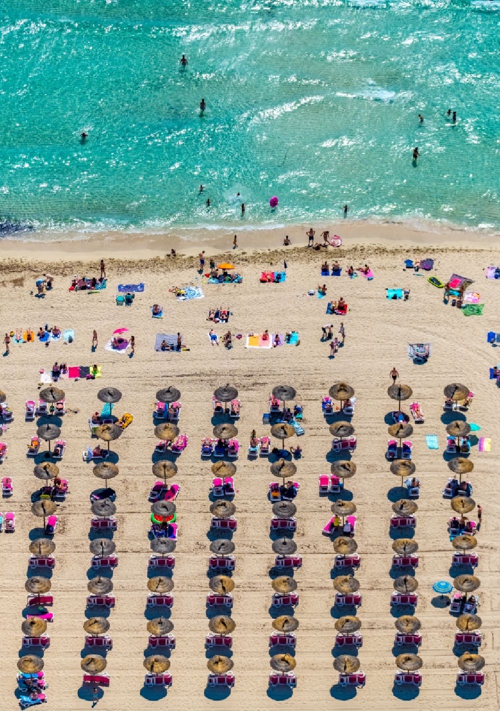 Aerial photograph Cala Anguila-Cala Mendia - Beach landscape along the with umbrella - rows on CALA Estany d'en Mas in Cala Anguila-Cala Mendia in Balearic island of Mallorca, Spain