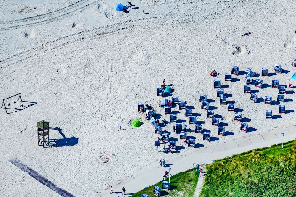 Aerial image Norderney - Sandy beach landscape with beach baskets on the western beach on the island of Norderney in the state of Lower Saxony, Germany