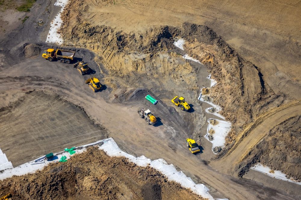 Hünxe from the bird's eye view: Renovation, sealing and restoration work on the site of the refurbished landfill in Huenxe in the state North Rhine-Westphalia, Germany
