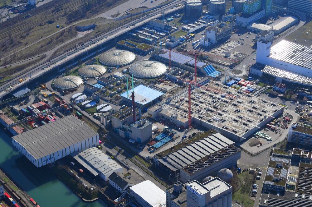 Basel from above - New construction site and extension of the sewage treatment basins and purification stages of the plant of ProRheno in the district Kleinhueningen in Basel, Switzerland