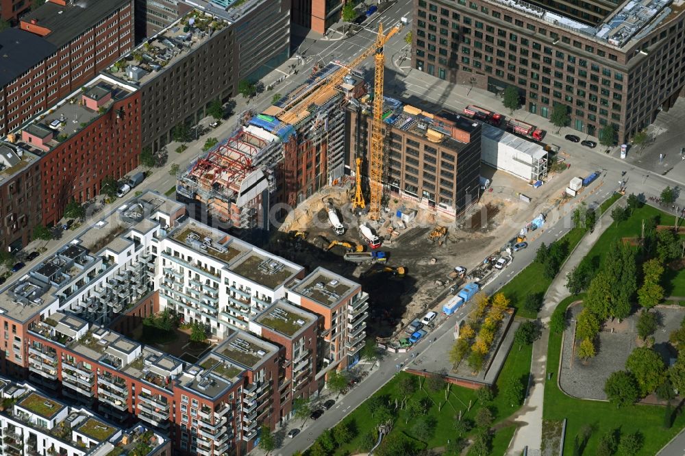 Hamburg from the bird's eye view: Construction site for reconstruction and modernization and renovation of a building of Kulturcompagnie on Shanghaiallee in the district HafenCity in Hamburg, Germany